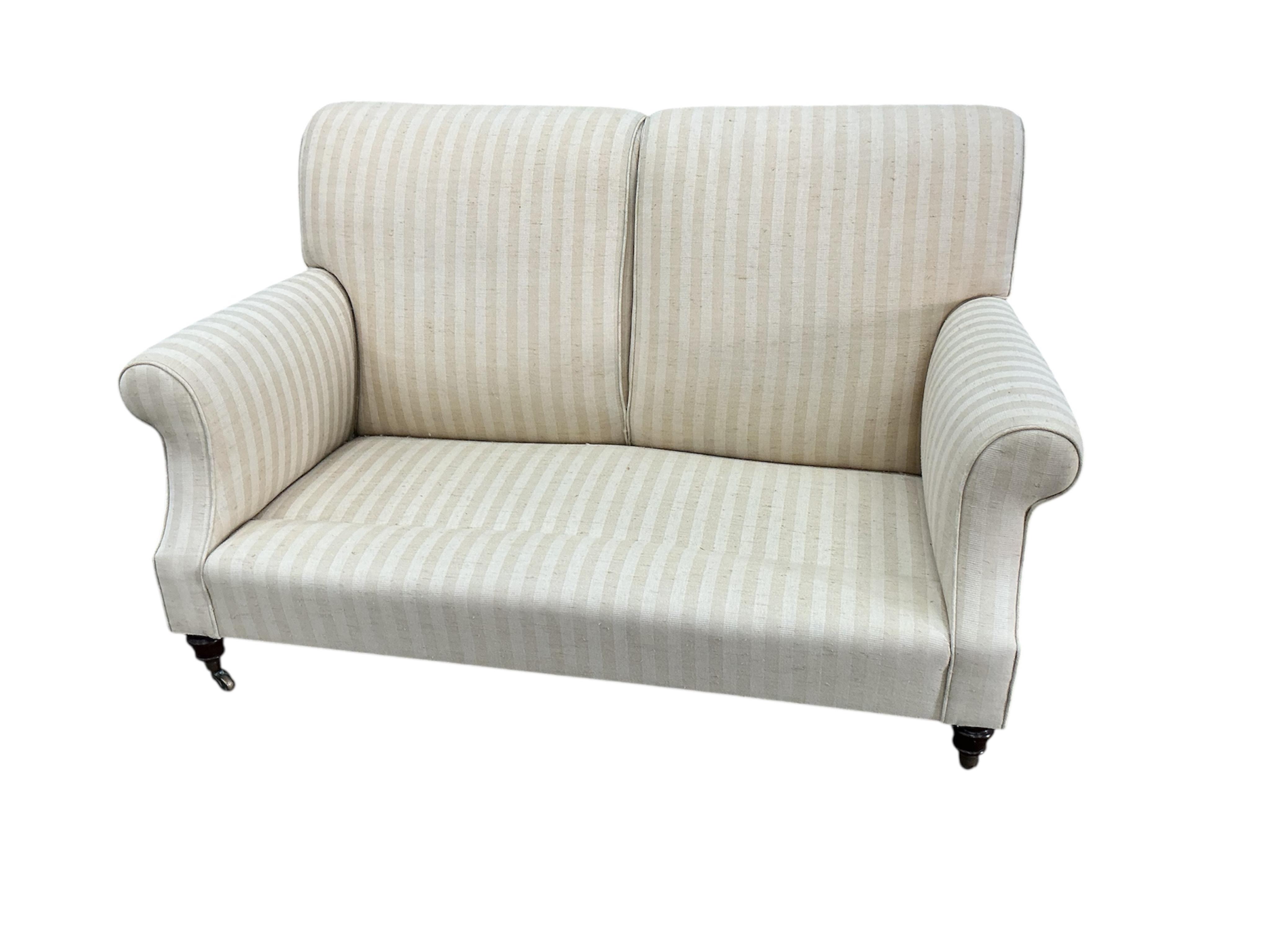 A Victorian style upholstered scroll arm two seater settee, width 150cm, depth 76cm, height 92cm